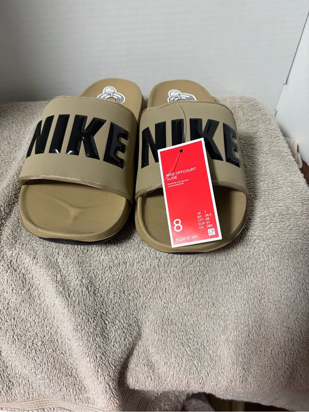 Nike Tan Slide Sandals with Black NIKE Logo